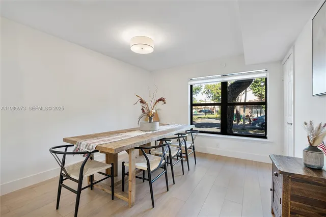 a balcony with furniture and a potted plant