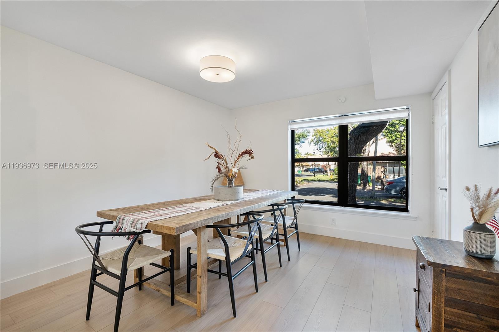 13234 Southwest 111th Terrace, Unit 44 Miami, FL 33186 - Photo 17 of 29 a dining room with furniture and window