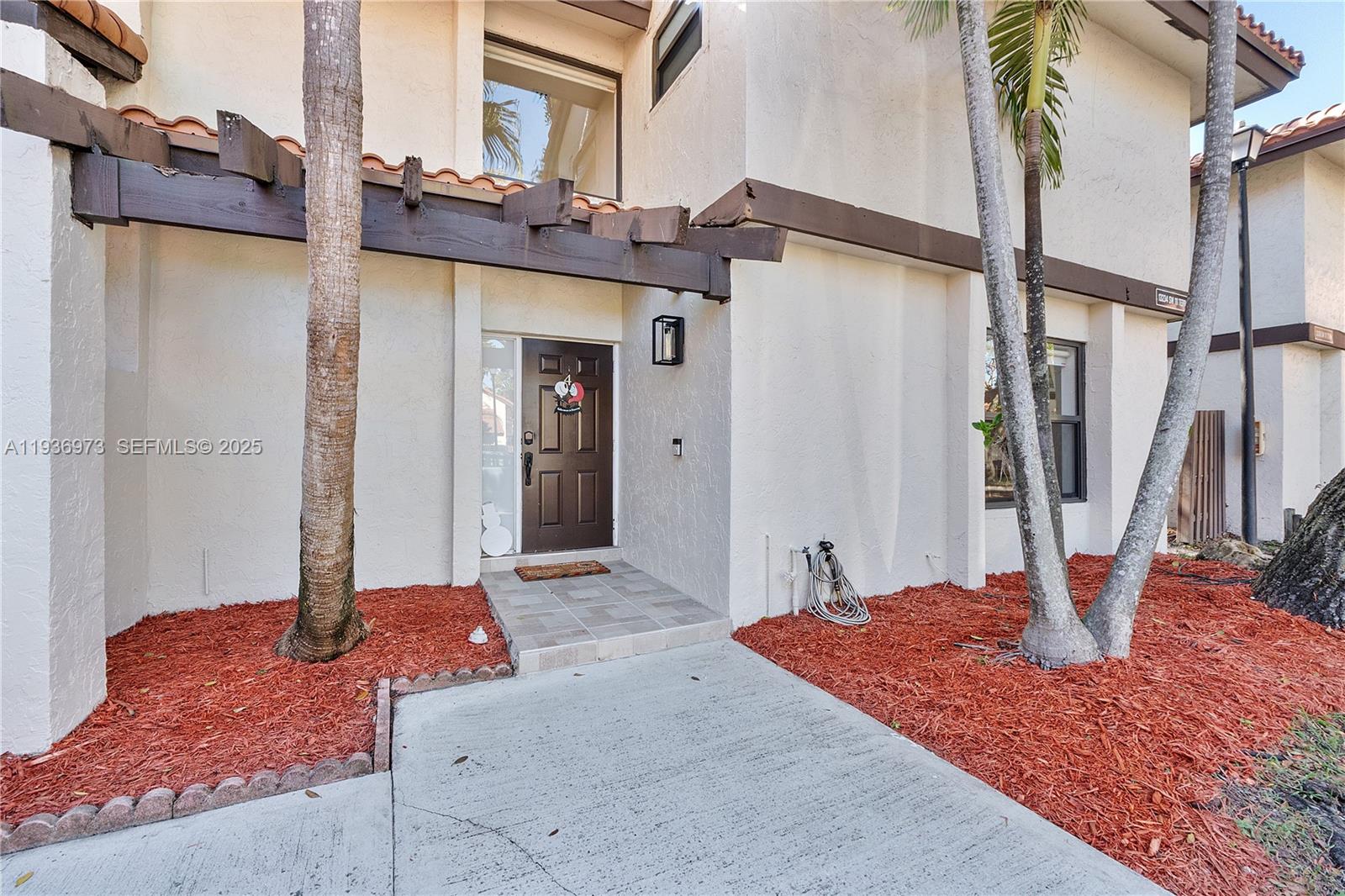 13234 Southwest 111th Terrace, Unit 44 Miami, FL 33186 - Photo 25 of 29 a front view of a house