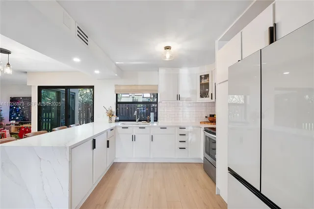 a view of a dining room with furniture and window