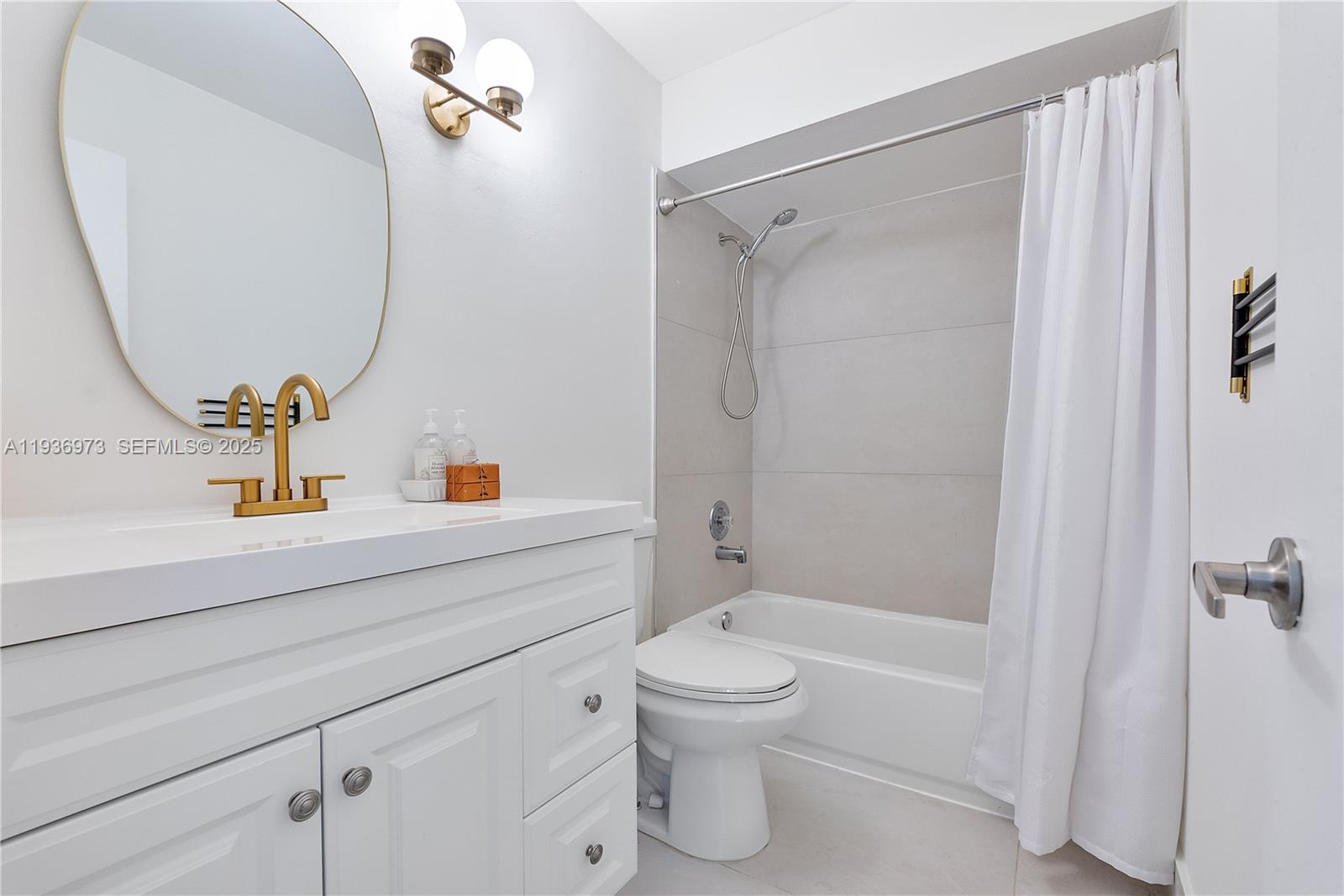 13234 Southwest 111th Terrace, Unit 44 Miami, FL 33186 - Photo 9 of 29 a bathroom with a sink a toilet and shower