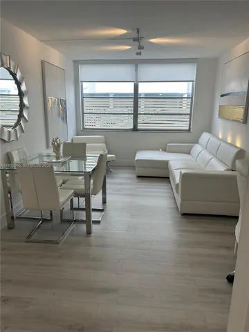 a view of a livingroom with furniture and window