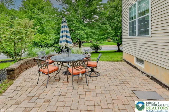 a view of a chairs and table in the patio