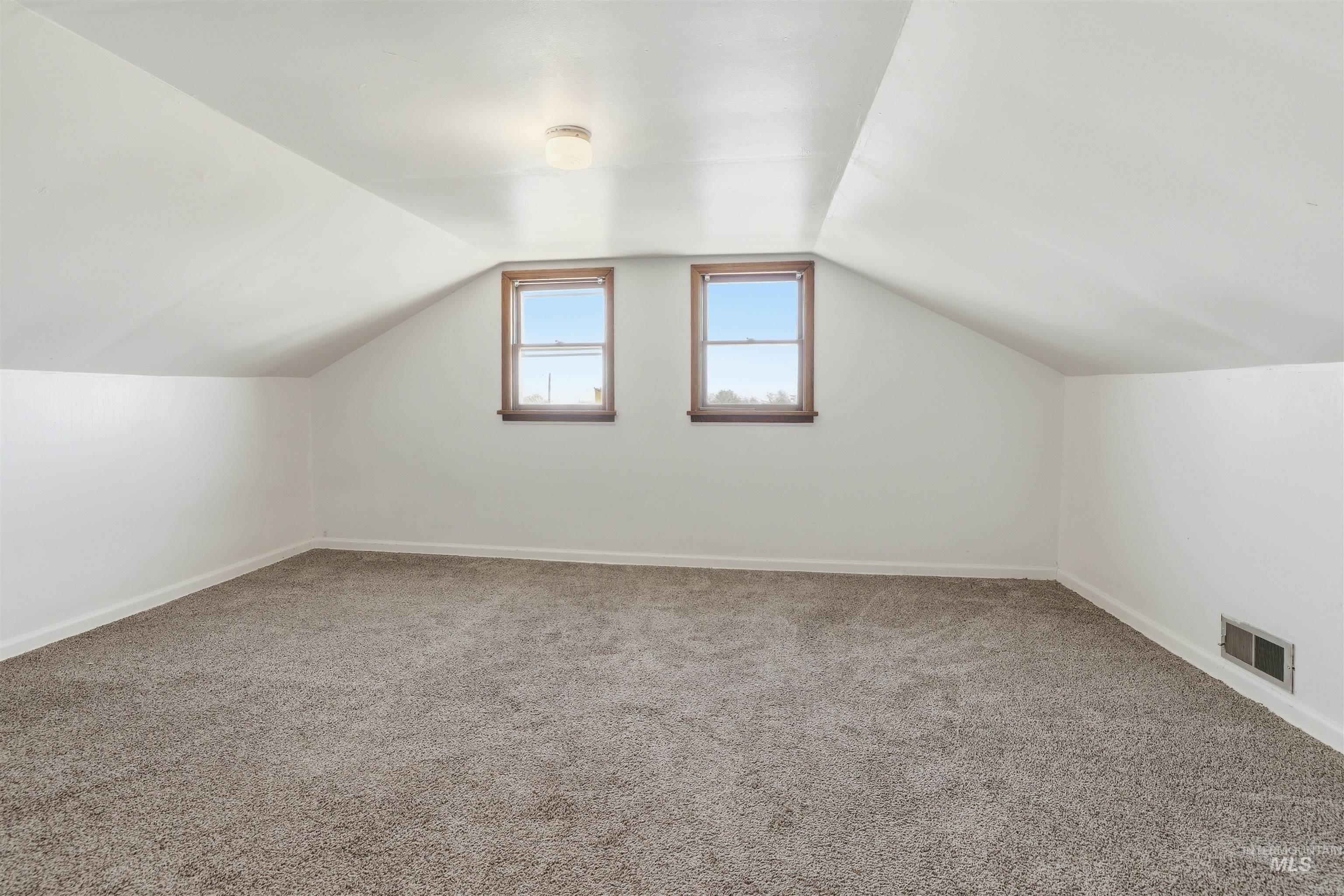 116 13th Avenue North Buhl, ID 83316 - Photo 11 of 37 Additional living space with carpet flooring and baseboards