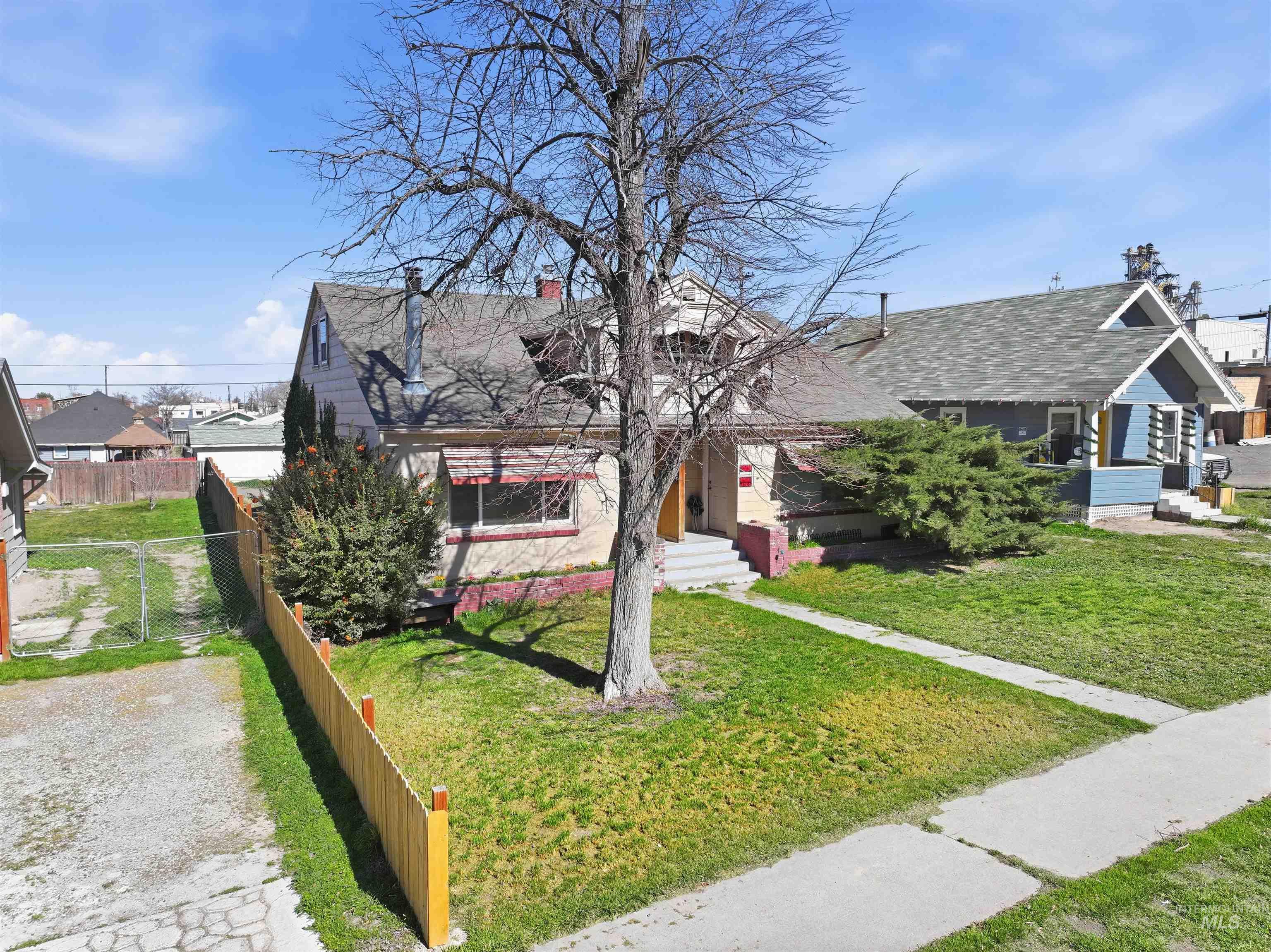 116 13th Avenue North Buhl, ID 83316 - Photo 24 of 37 View of front of property featuring a shingled roof and a chimney
