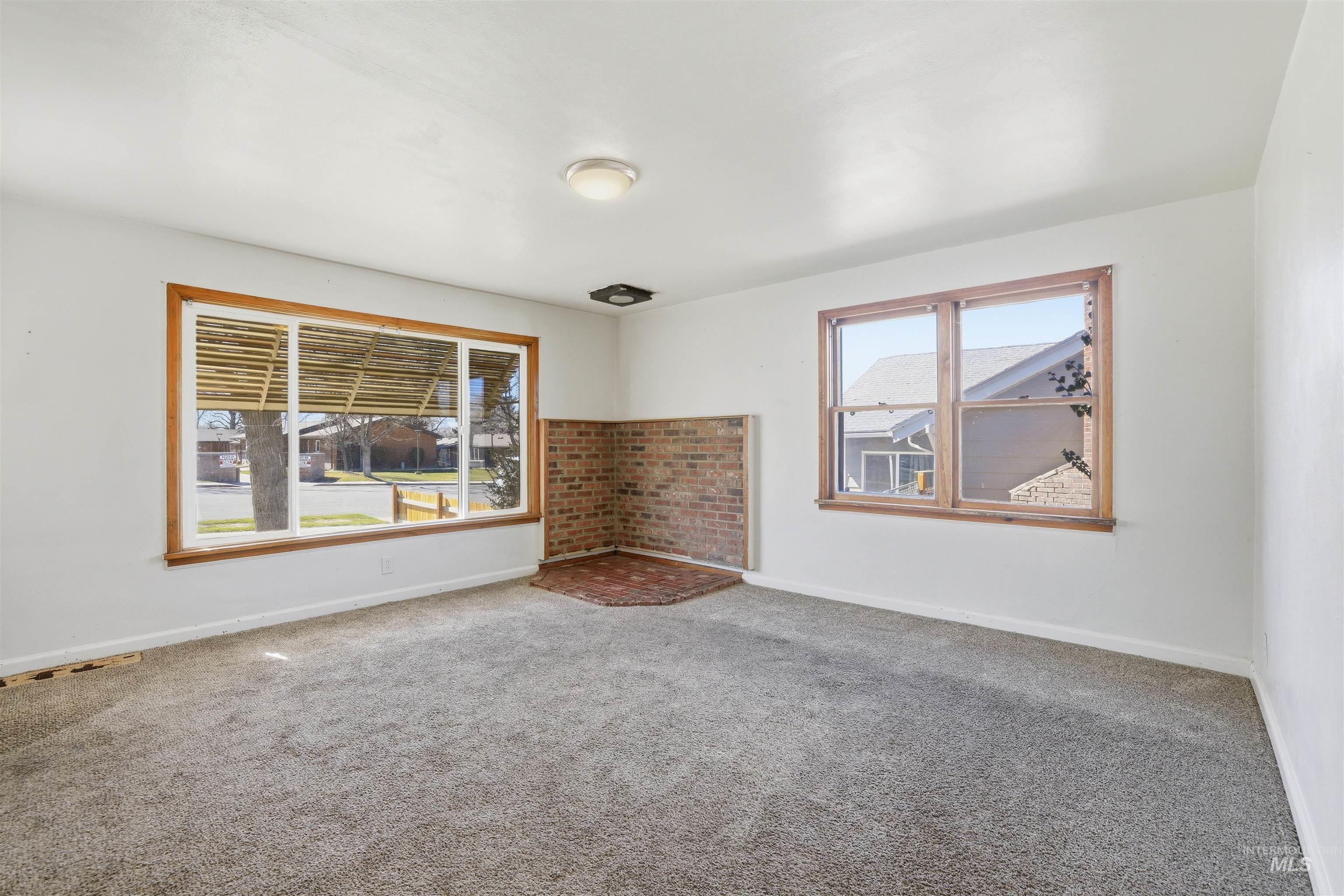 116 13th Avenue North Buhl, ID 83316 - Photo 4 of 37 Unfurnished room with carpet and baseboards