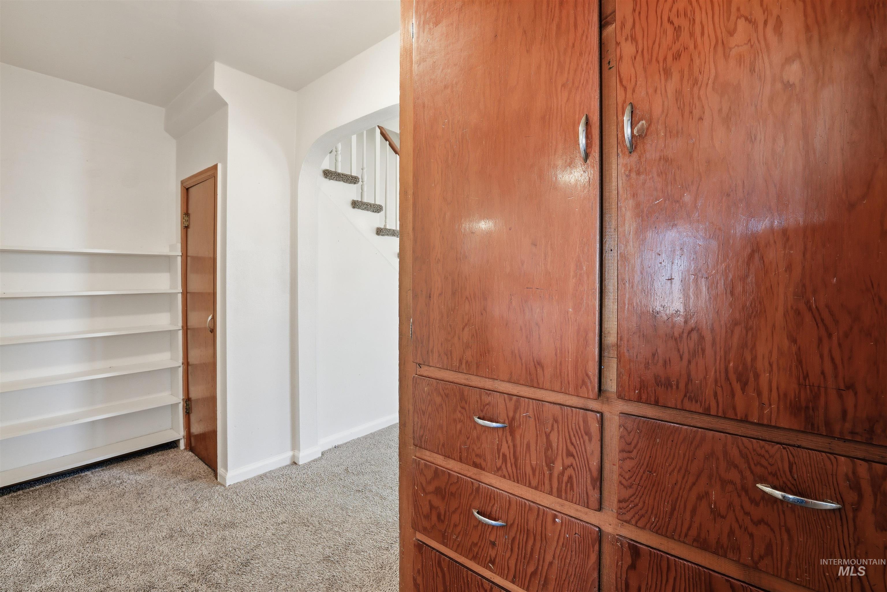 116 13th Avenue North Buhl, ID 83316 - Photo 6 of 37 Walk in closet with arched walkways and light colored carpet