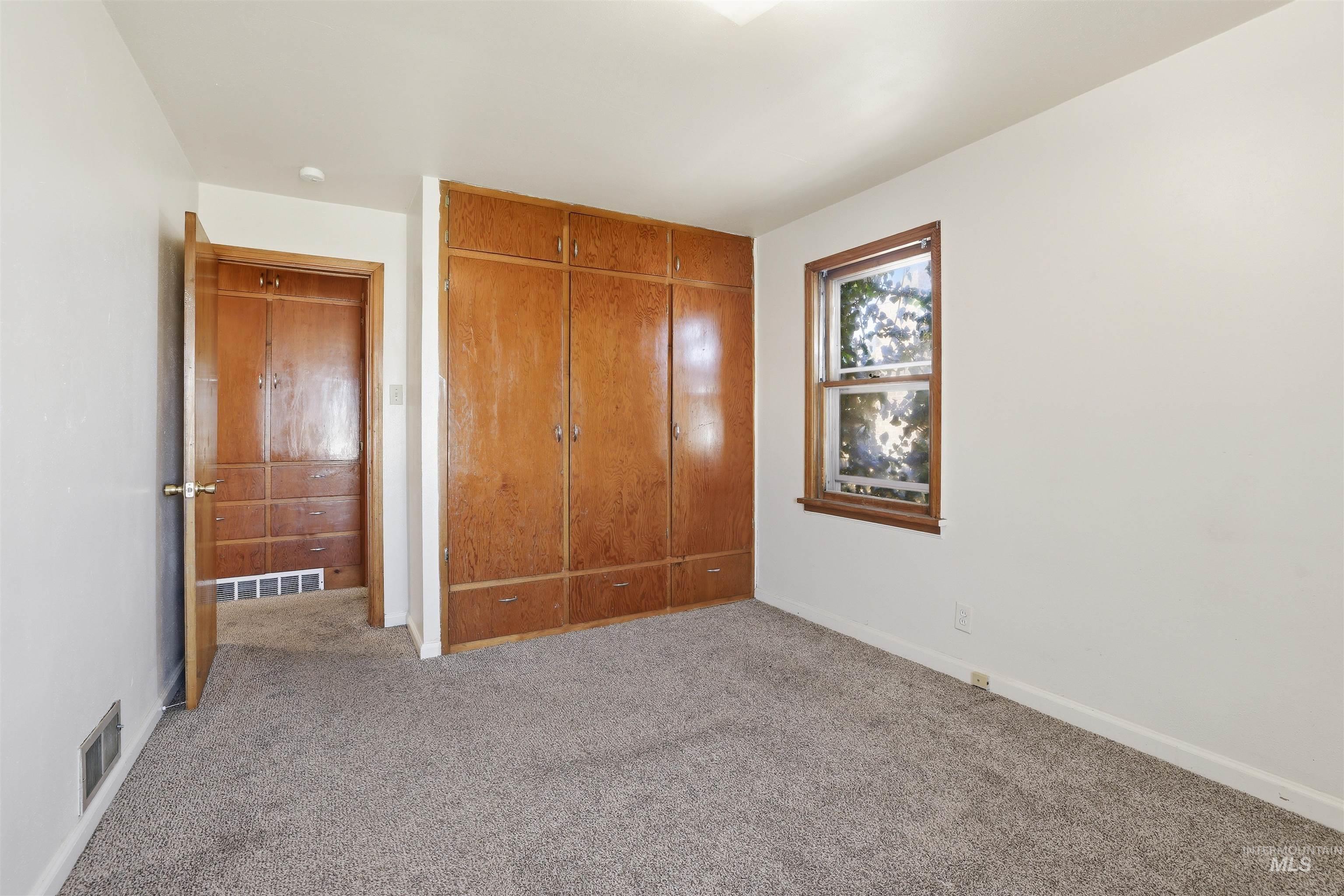 116 13th Avenue North Buhl, ID 83316 - Photo 7 of 37 Unfurnished bedroom featuring carpet and a closet