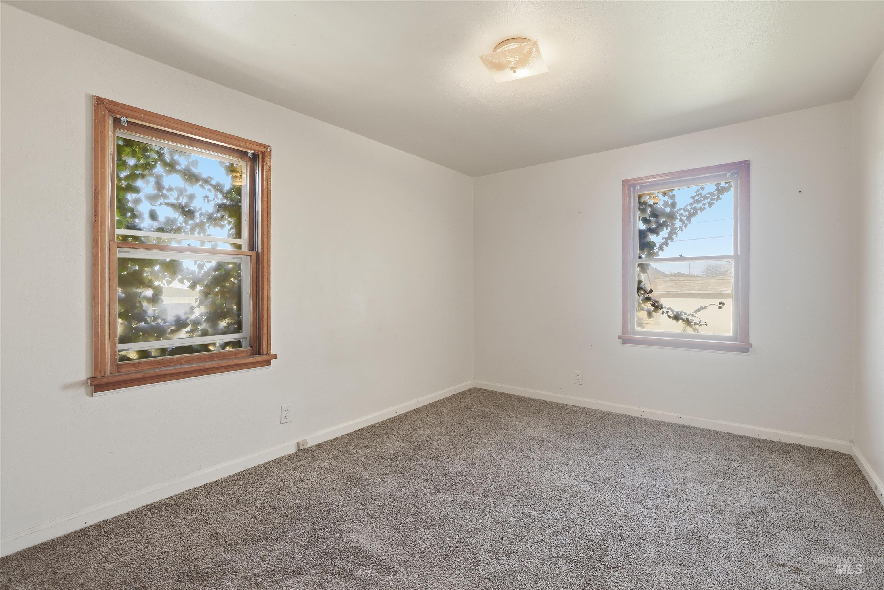 116 13th Avenue North Buhl, ID 83316 - Photo 8 of 37 Carpeted empty room with baseboards