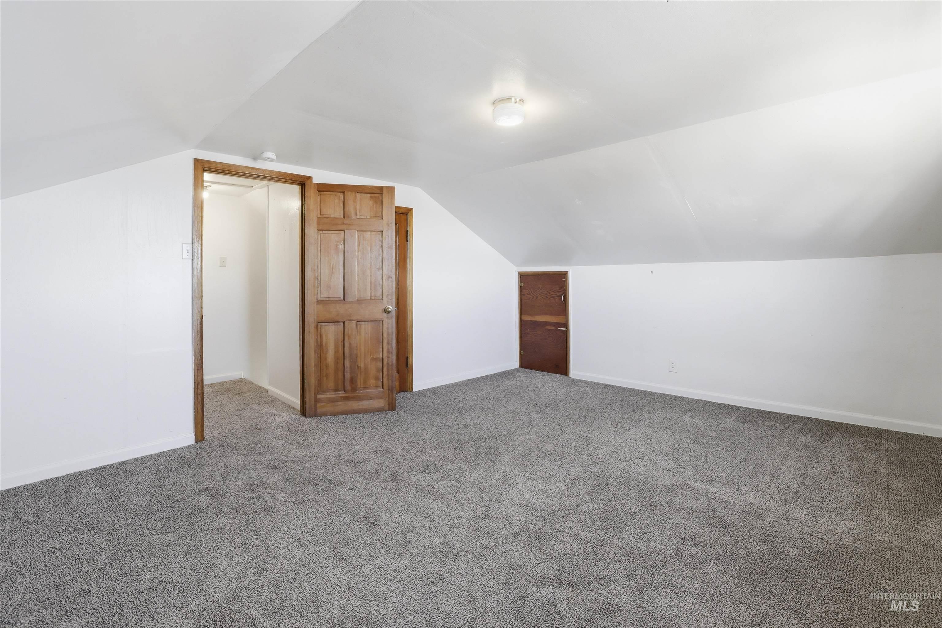 116 13th Avenue North Buhl, ID 83316 - Photo 10 of 37 Additional living space with carpet flooring and baseboards
