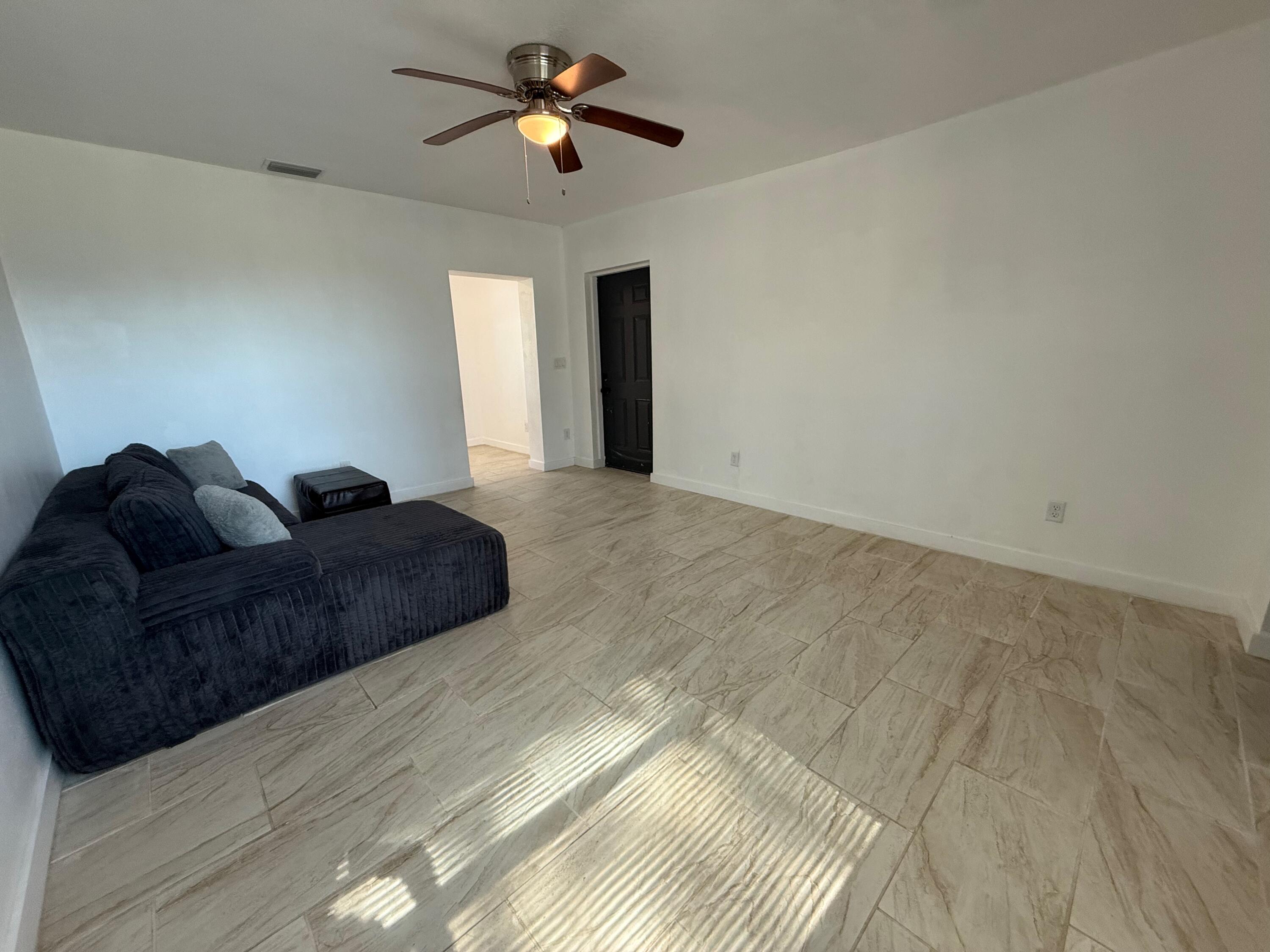 2104 North 53rd Street Fort Pierce, FL 34946 - Photo 5 of 15 LIVING ROOM TO KITCHEN