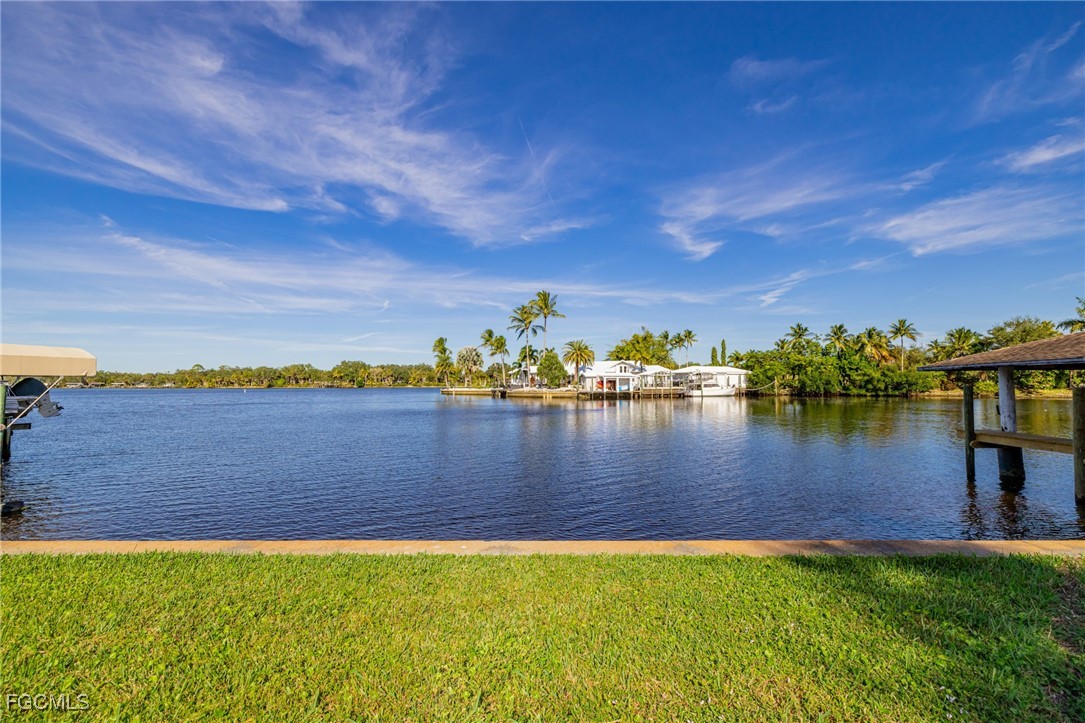 14502 Riverside Drive Fort Myers, FL 33905 - Photo 25 of 33 a view of a lake with houses in the back
