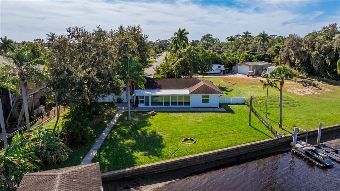 14502 Riverside Drive Fort Myers, FL 33905 - Photo 32 of 33 a view of a pool with a patio and a yard