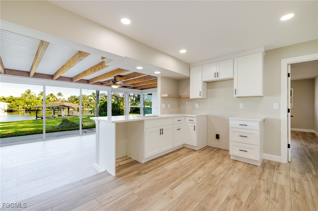 14502 Riverside Drive Fort Myers, FL 33905 - Photo 10 of 33 a view of kitchen with furniture and wooden floor
