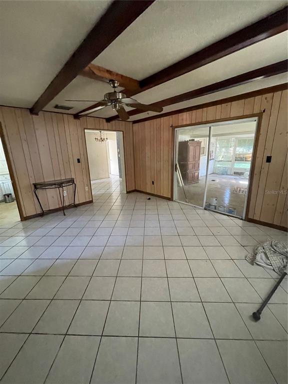 6442 Inca Street Orlando, FL 32807 - Photo 11 of 30 Large living area leading to back porch area and carport.