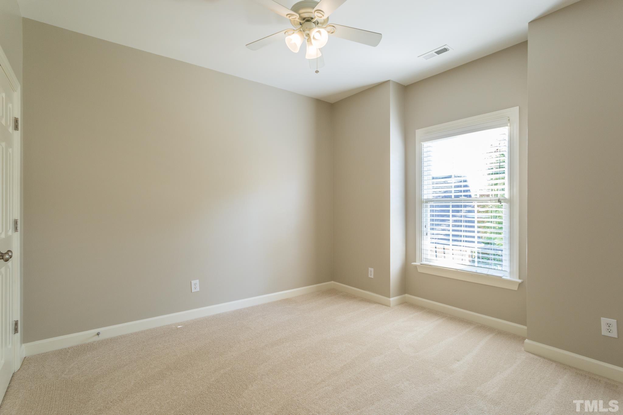 12008 Joseph Drive Raleigh, NC 27614 - Photo 22 of 25 Beautiful curved wall of windows- overlooks the backyard.