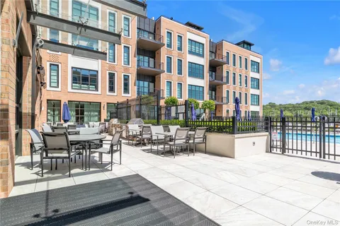 a building outdoor space with couple of sitting space