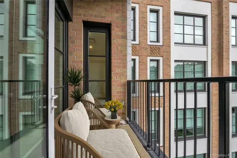 a balcony view with a potted plant