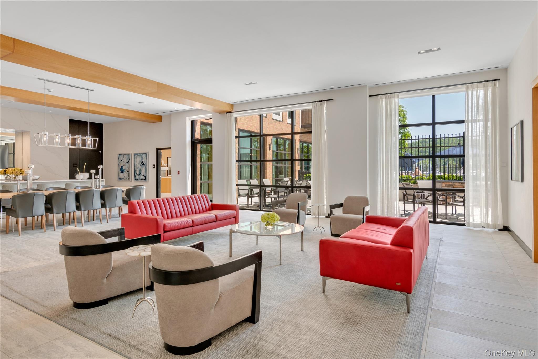 100 Garvies Point Road, Unit 1238 Glen Cove, NY 11542 - Photo 24 of 41 a living room with furniture and a floor to ceiling window