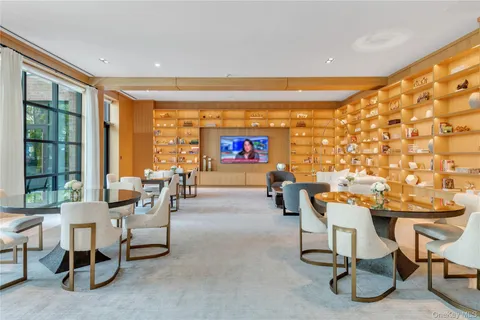 a view of a room with gym equipment and a large window