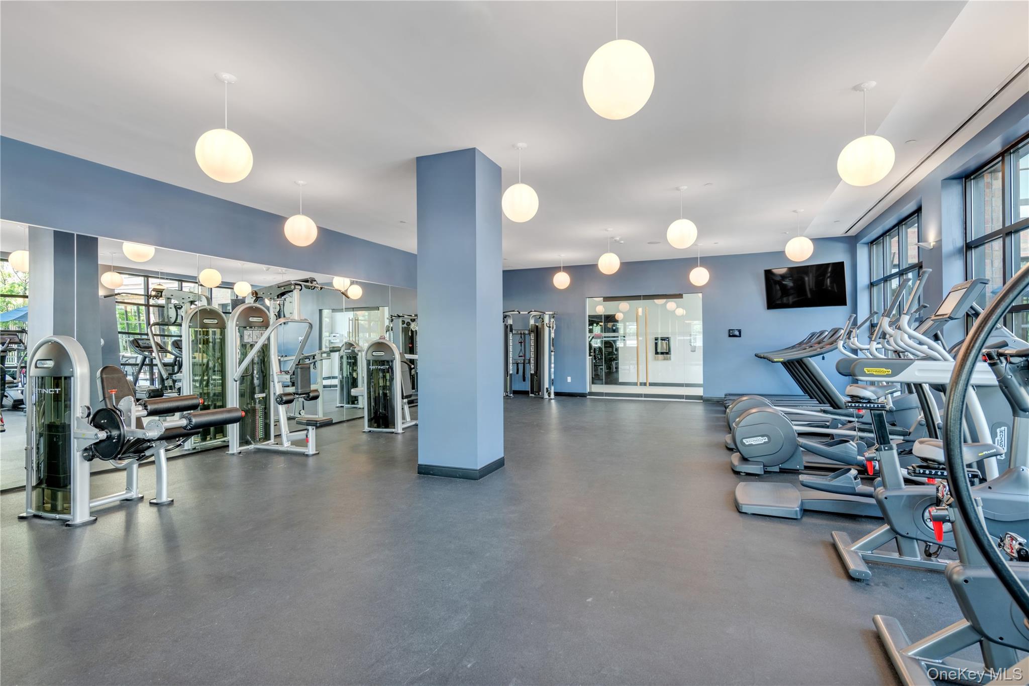 100 Garvies Point Road, Unit 1238 Glen Cove, NY 11542 - Photo 28 of 41 a view of a room with gym equipment
