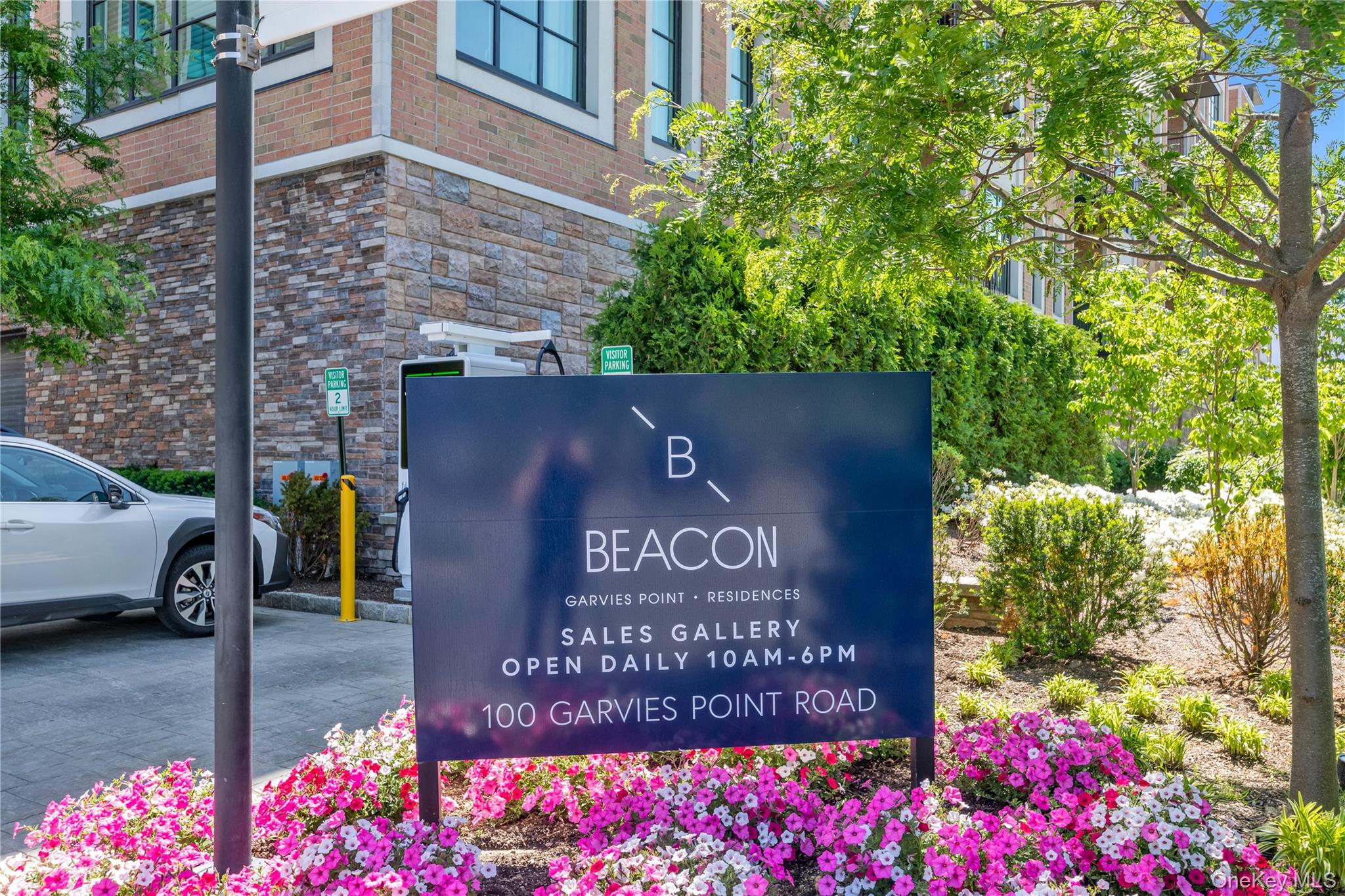 100 Garvies Point Road, Unit 1238 Glen Cove, NY 11542 - Photo 34 of 41 a view of outdoor space with sign board