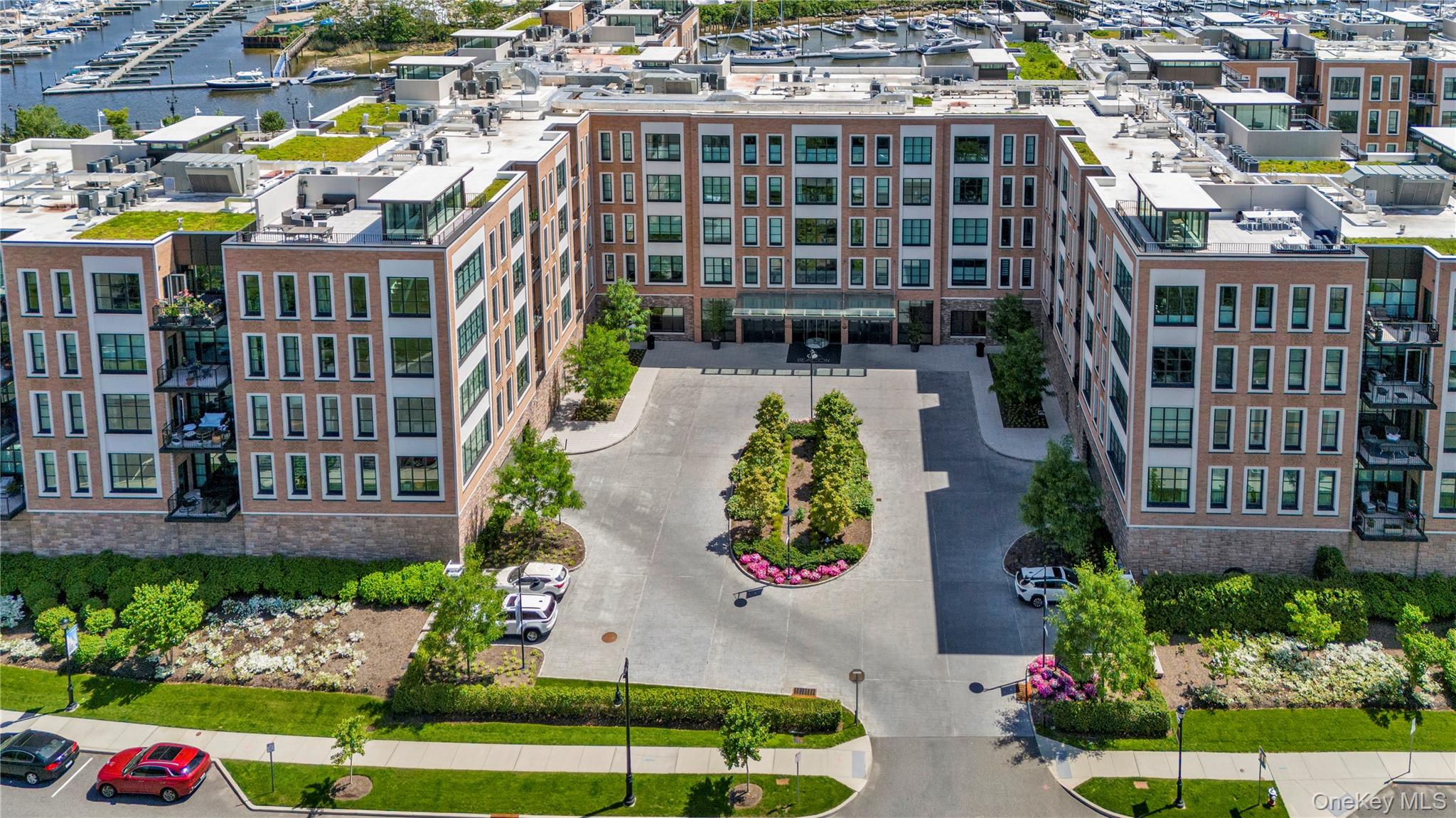 100 Garvies Point Road, Unit 1238 Glen Cove, NY 11542 - Photo 4 of 41 an aerial view of multiple house
