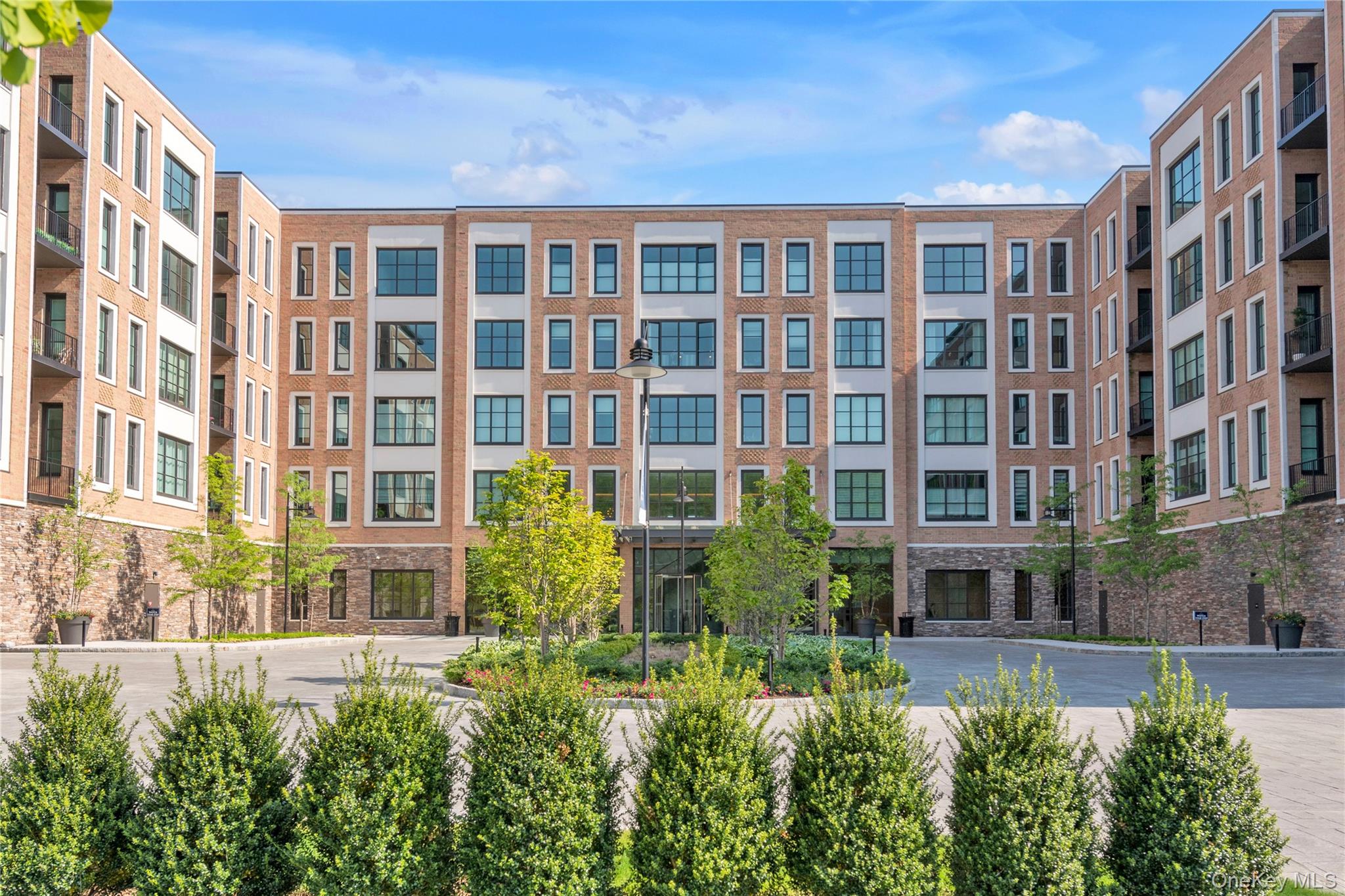 100 Garvies Point Road, Unit 1238 Glen Cove, NY 11542 - Photo 7 of 41 a view of a building in the middle of a building