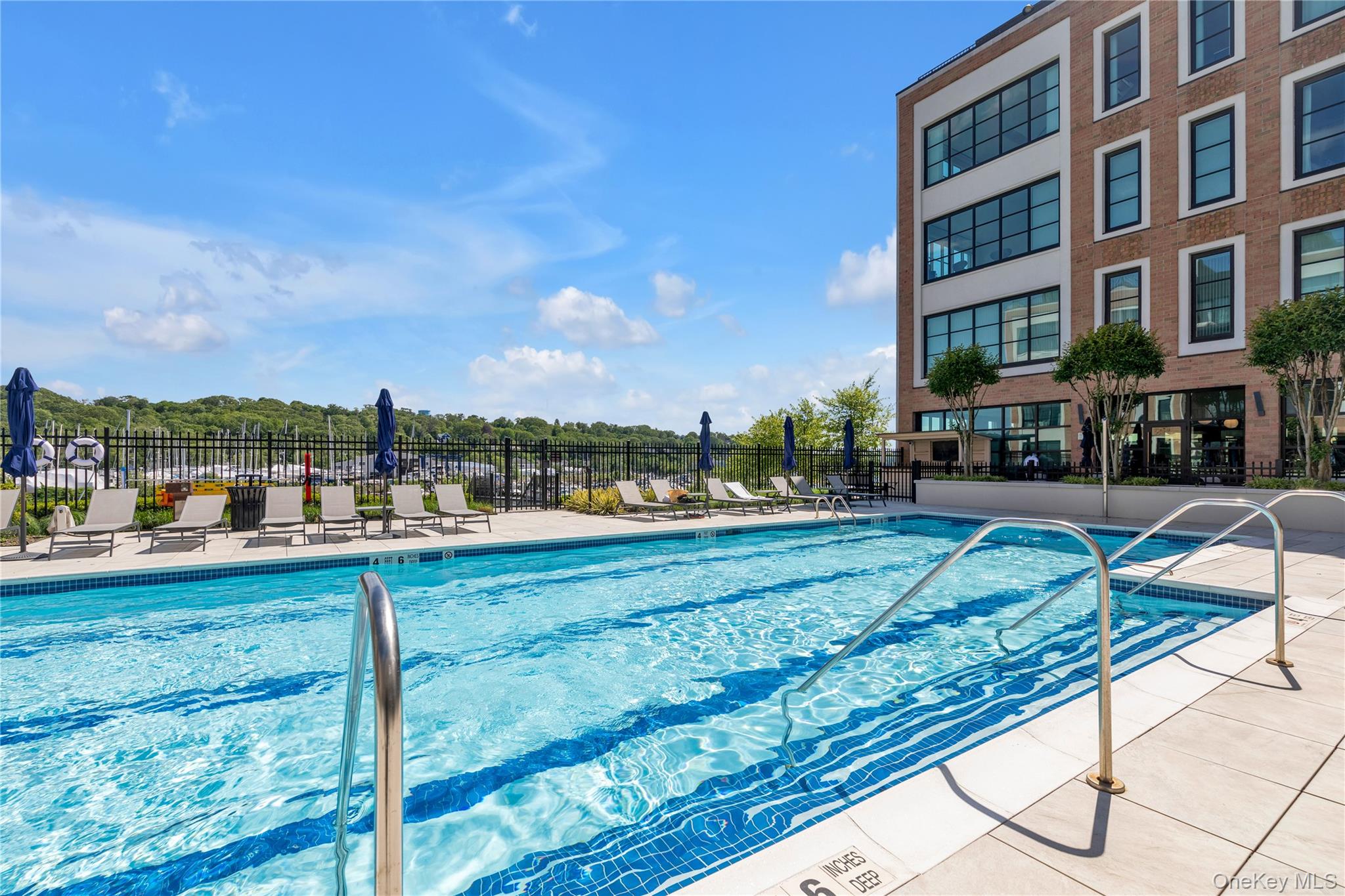100 Garvies Point Road, Unit 1238 Glen Cove, NY 11542 - Photo 9 of 41 a view of a yard and front view of a building
