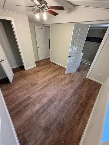 a view of a house with a tree in the background