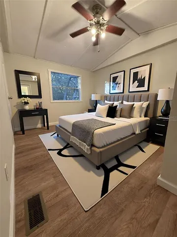 a large kitchen with a table and chairs