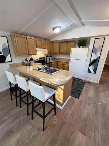 a bedroom with furniture and a large window