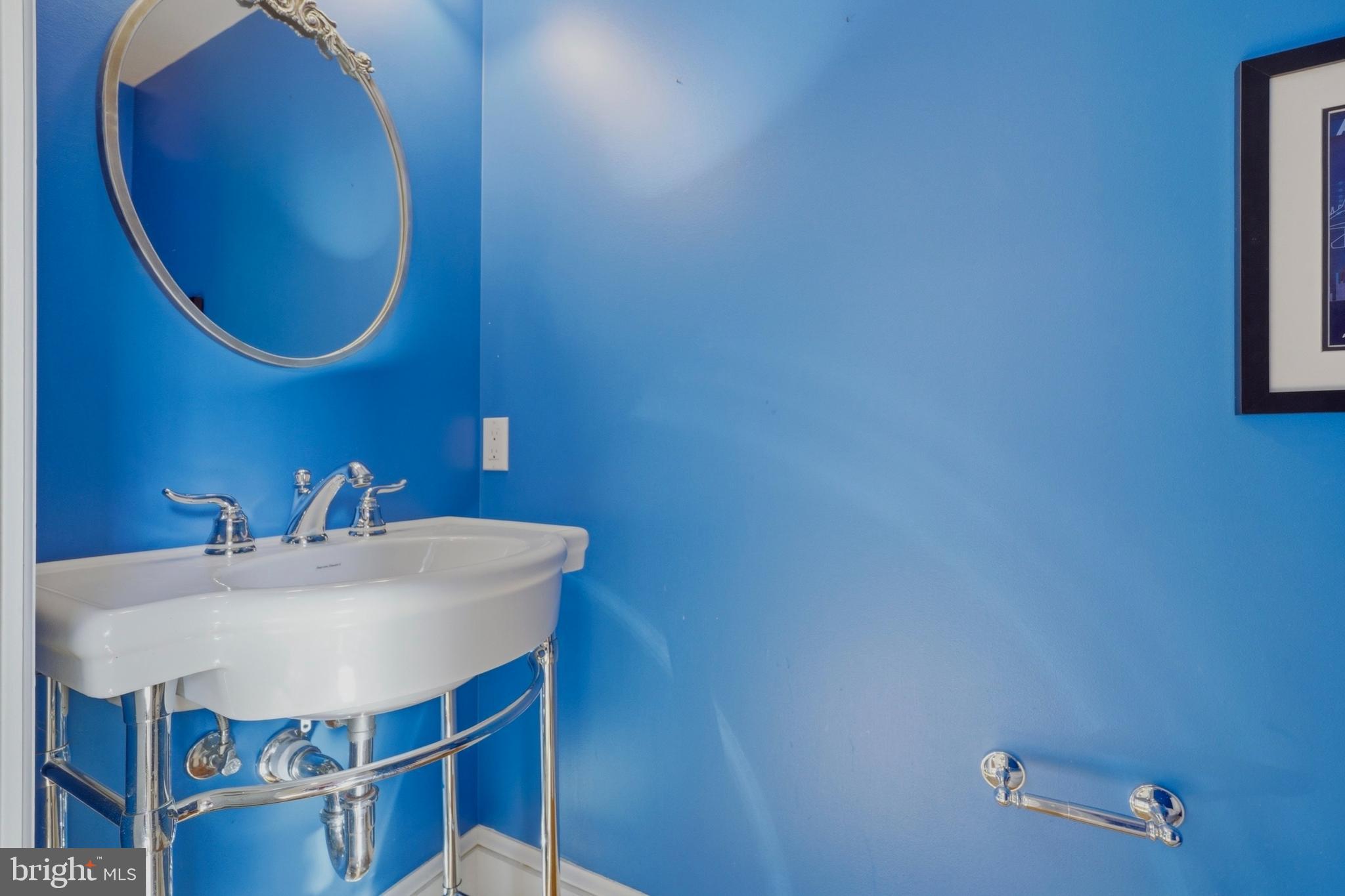 1002 N Street Northwest Washington, DC 20001 - Photo 14 of 33 a bathroom with a sink mirror and vanity
