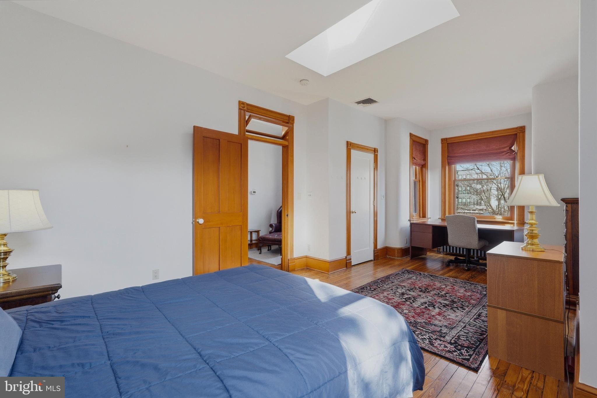 1002 N Street Northwest Washington, DC 20001 - Photo 18 of 33 a bedroom with a bed and a dresser next to a window
