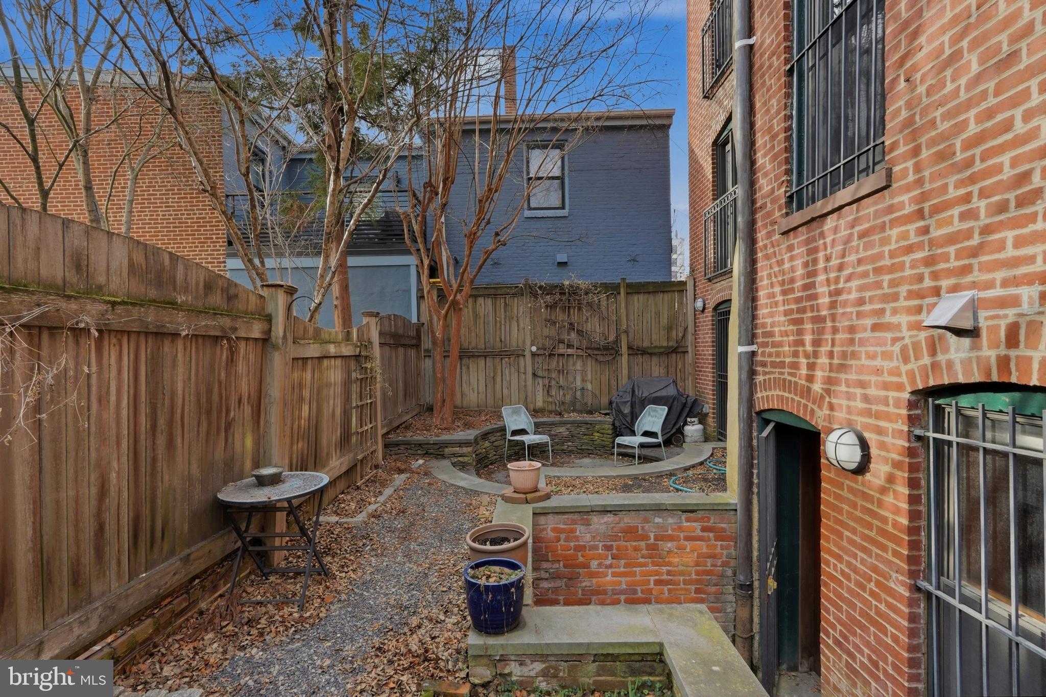 1002 N Street Northwest Washington, DC 20001 - Photo 33 of 33 a view of a house with backyard and wooden fence