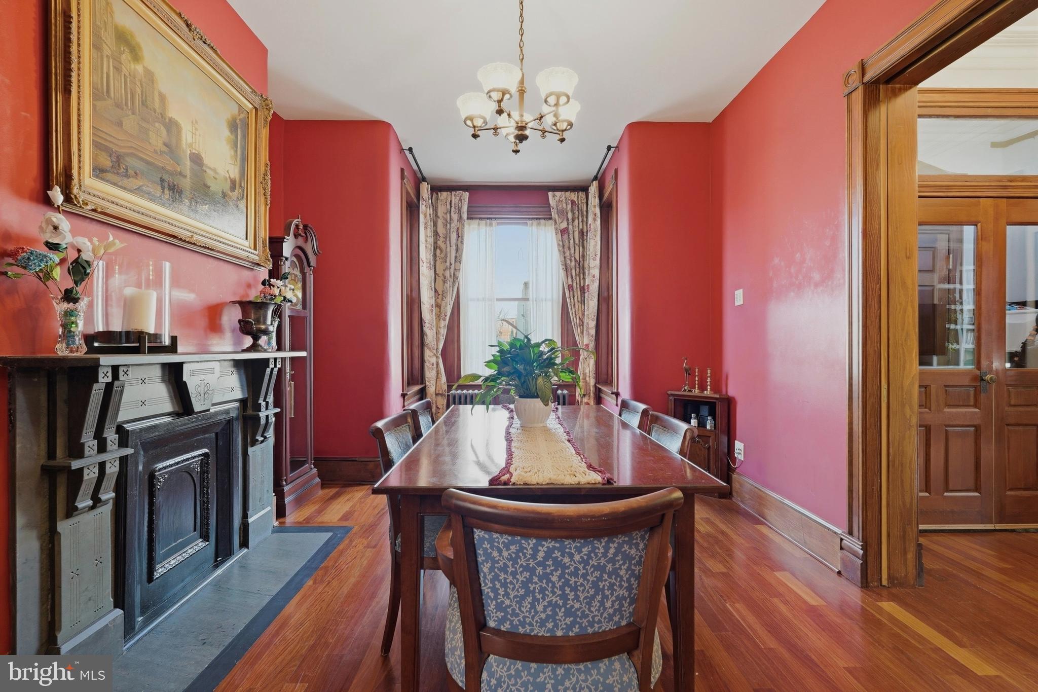 1002 N Street Northwest Washington, DC 20001 - Photo 7 of 33 a dining room with furniture a chandelier and wooden floor