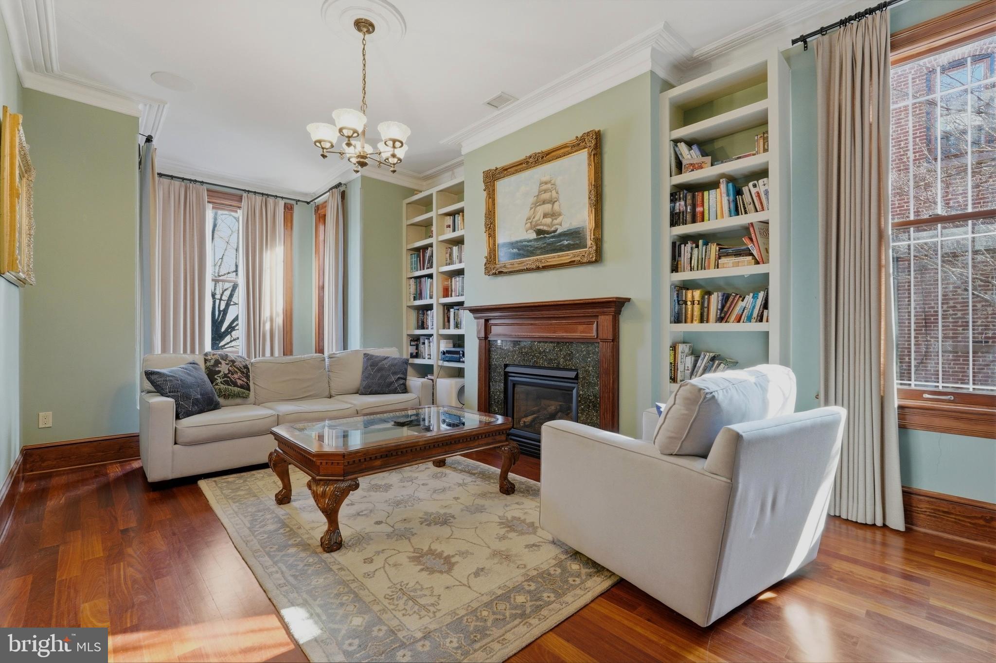 1002 N Street Northwest Washington, DC 20001 - Photo 8 of 33 a living room with furniture and a fireplace