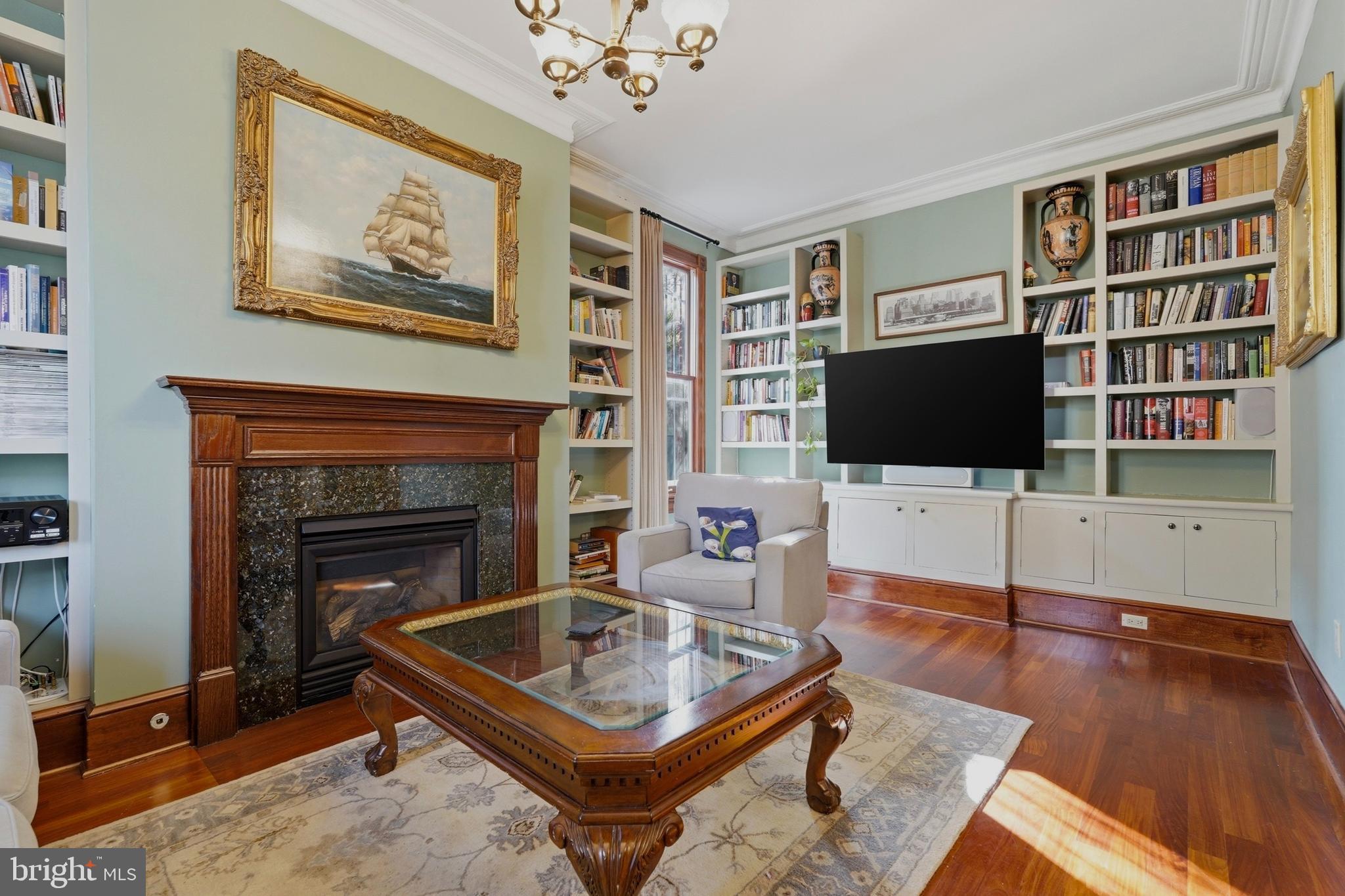 1002 N Street Northwest Washington, DC 20001 - Photo 9 of 33 a living room with furniture and a flat screen tv
