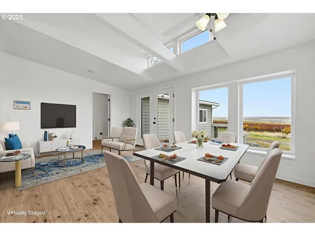 a view of a dining room with furniture window and outside view