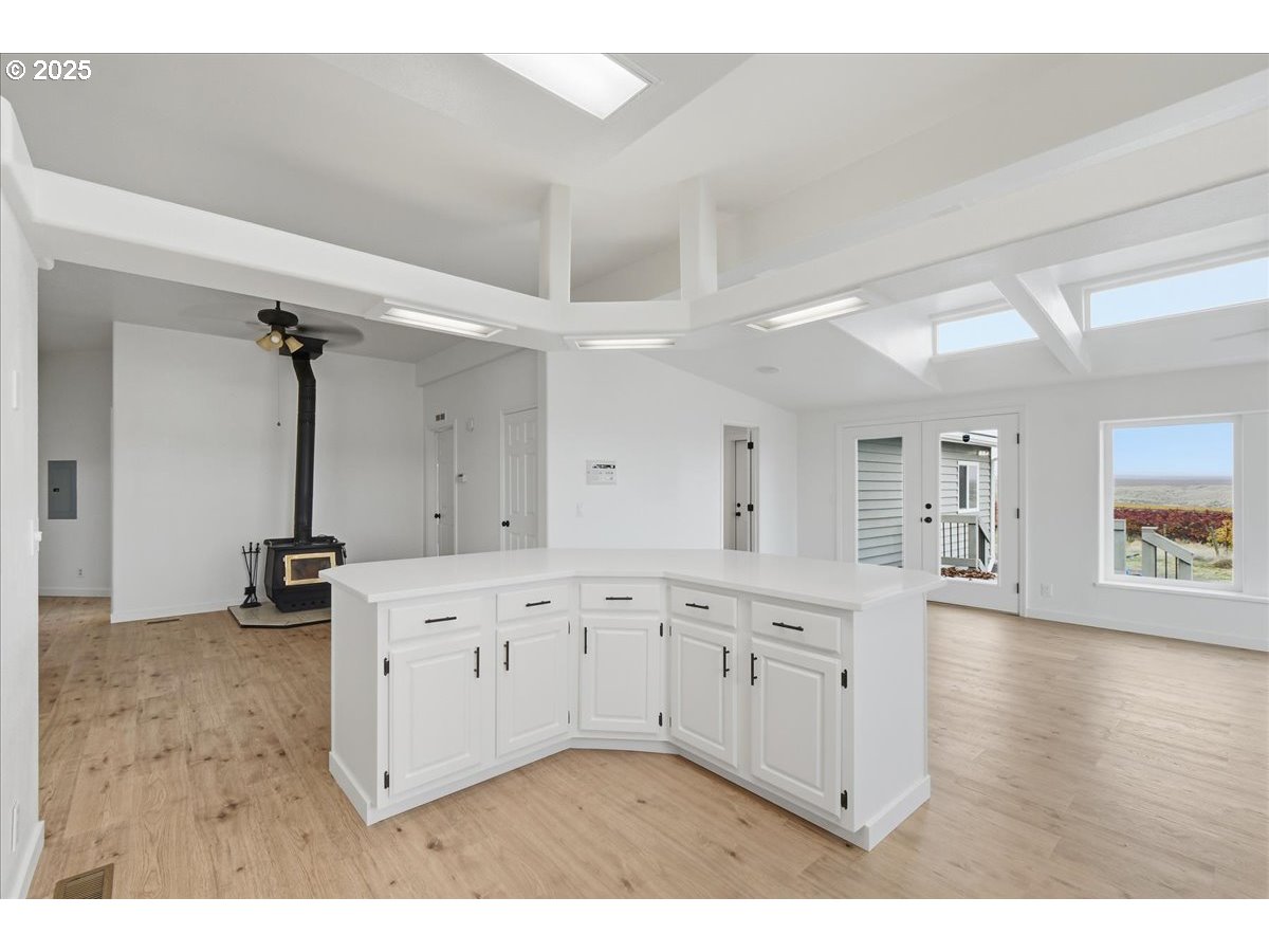 499 Alderdale Road Prosser, WA 99350 - Photo 18 of 41 a kitchen with cabinets and wooden floor