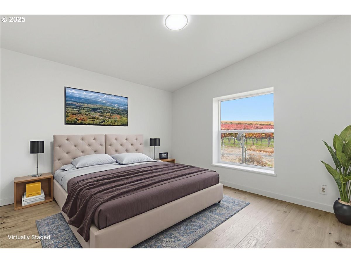 499 Alderdale Road Prosser, WA 99350 - Photo 24 of 41 a bedroom with a large bed and a window