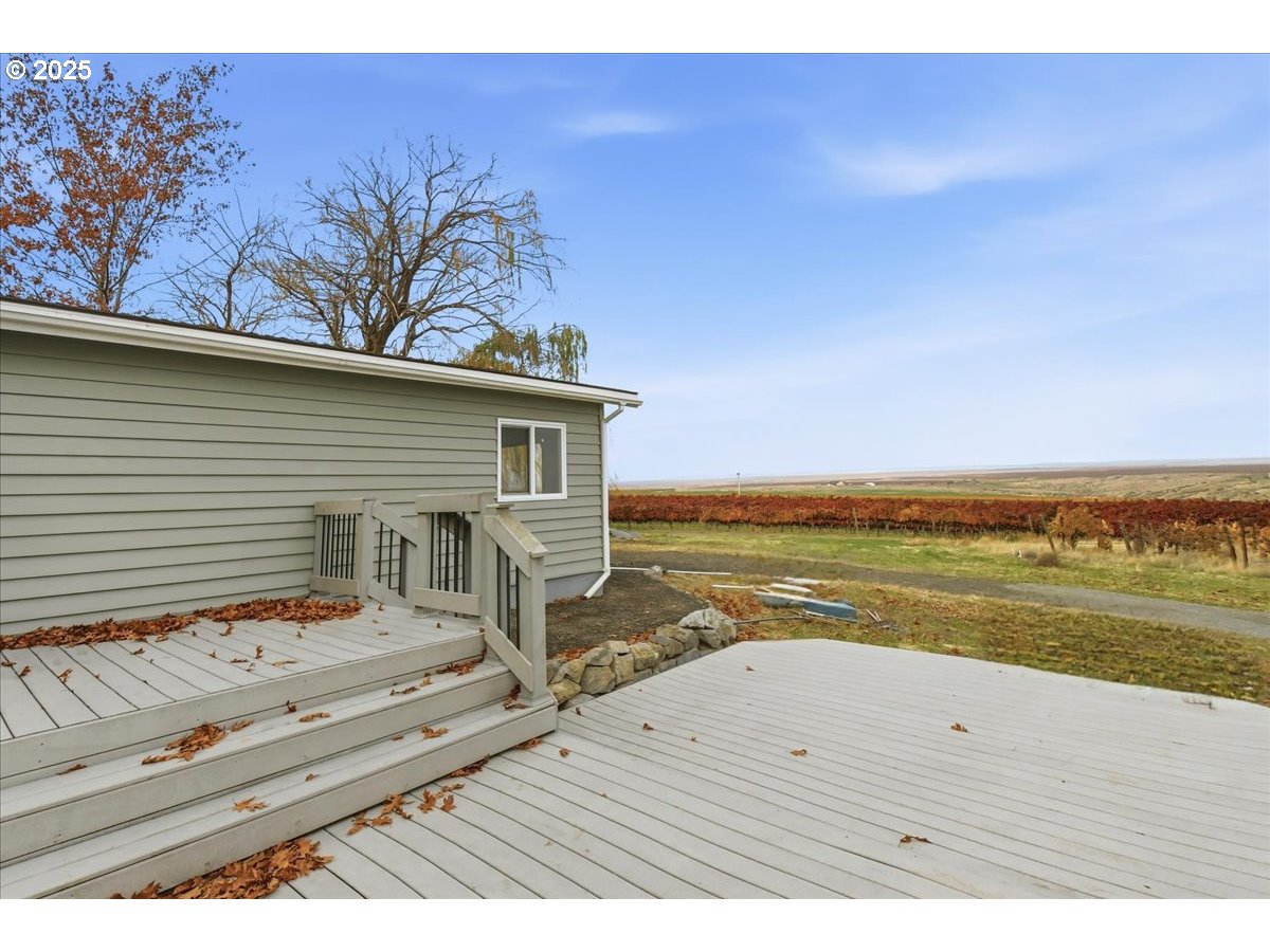 499 Alderdale Road Prosser, WA 99350 - Photo 32 of 41 a view of a terrace with wooden floor and a lake view