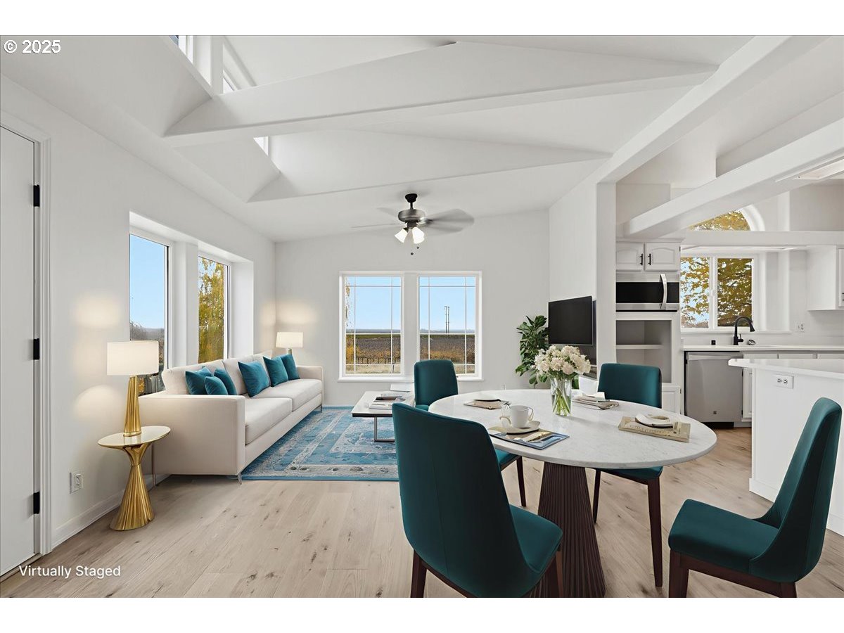 499 Alderdale Road Prosser, WA 99350 - Photo 9 of 41 a view of a dining room with furniture and wooden floor