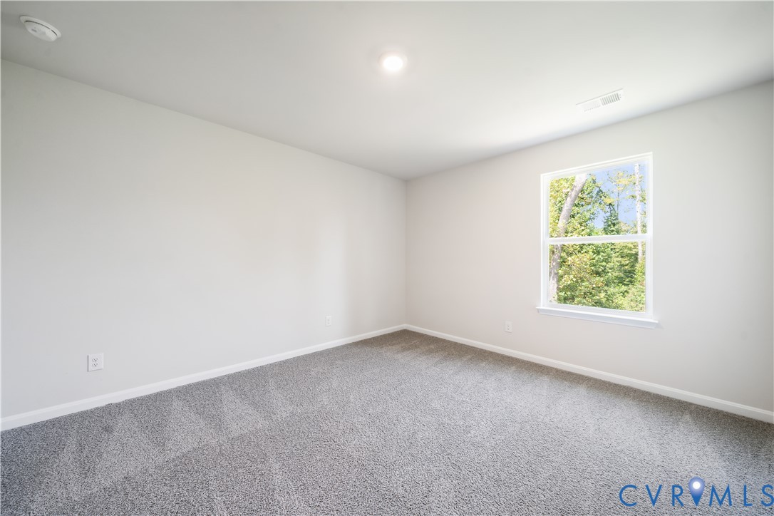 9529 Fuchsia Drive Richmond, VA 23237 - Photo 19 of 28 an empty room with a window