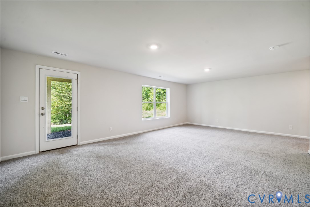 9529 Fuchsia Drive Richmond, VA 23237 - Photo 24 of 28 an empty room with windows