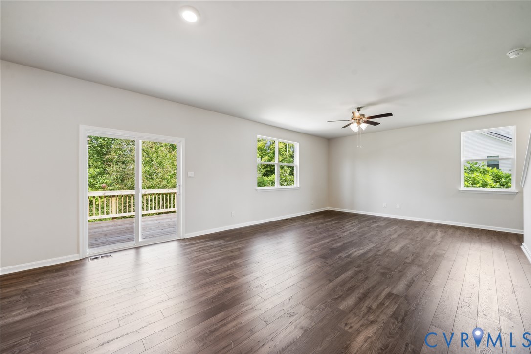 9529 Fuchsia Drive Richmond, VA 23237 - Photo 6 of 28 an empty room with wooden floor and windows