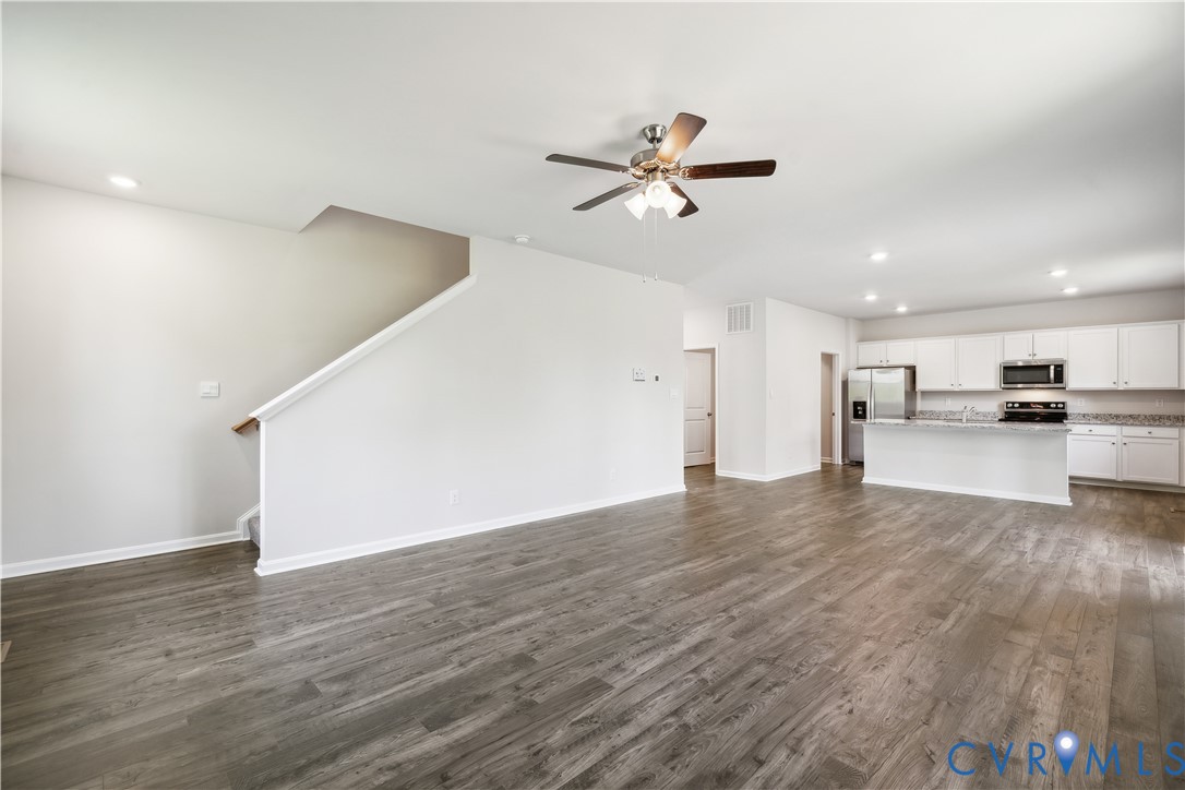 9529 Fuchsia Drive Richmond, VA 23237 - Photo 8 of 28 a view of a kitchen with wooden floor and a sink