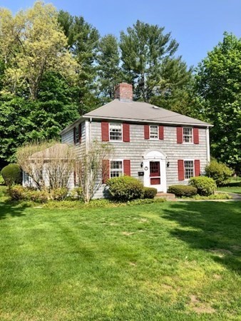 21 Fuller Brook Road Wellesley, MA 02482 - Photo 3 of 5 a front view of a house with a garden