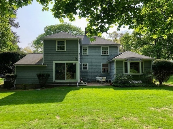 21 Fuller Brook Road Wellesley, MA 02482 - Photo 4 of 5 a front view of a house with a yard