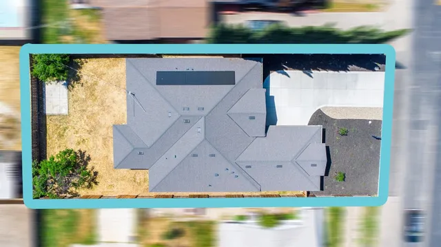 an aerial view of house with yard swimming pool and outdoor seating